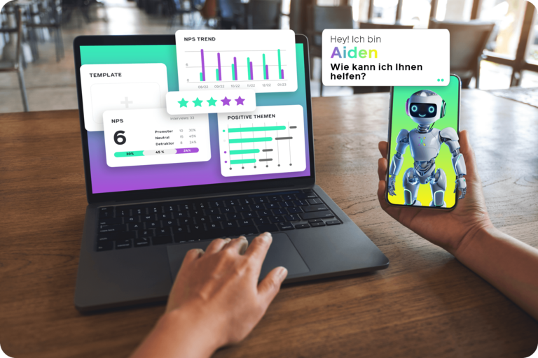 Eine Person nutzt einen Laptop mit Diagrammen und hält ein Smartphone, in dem sich ein humanoider Roboter als Aiden vorstellt